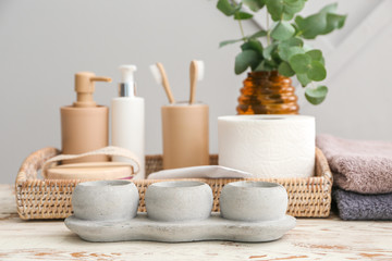Set of bath accessories on wooden table