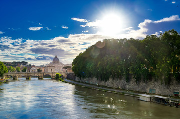 A view along the Tiber River towards St. Peter's Basilica in Rome, Italy.