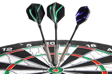 Dartboard with darts on white background, closeup