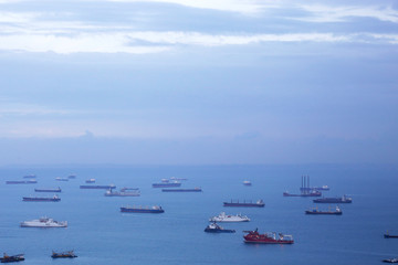 Aerial view of cargo ships in the roadstead. Marine landscape with business or commercial sense.