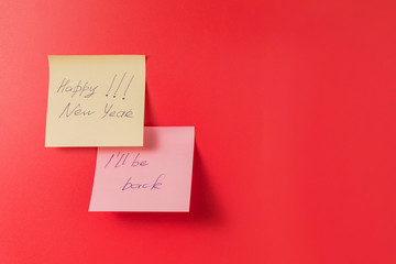 Paper stickers with the inscription on a red background