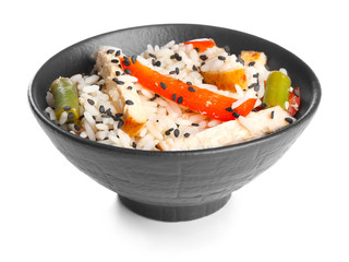 Bowl with tasty rice, chicken and vegetables on white background