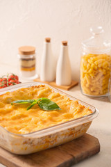 Baking dish with prepared lasagna on white table