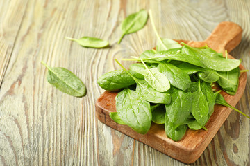 Fresh spinach on wooden background