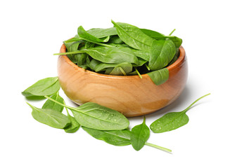 Bowl with fresh spinach on white background