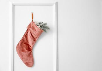 Christmas sock hanging om white wall