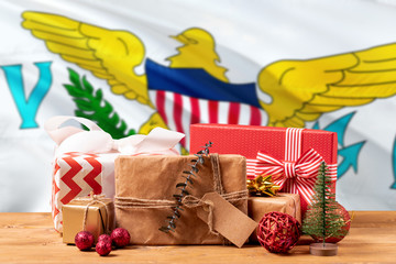 United States Virgin Islands new year celebration theme. Wrapped christmas gifts on waving national flag background. Merry christmas concept.