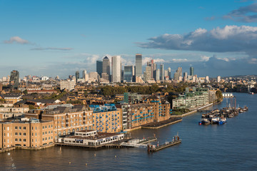 Fototapeta na wymiar View of Residential Buildings in Front of Thames River and Canary Wharf District in the Horizon, in London, UK