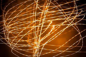 abstract light painting. Orange lights at night