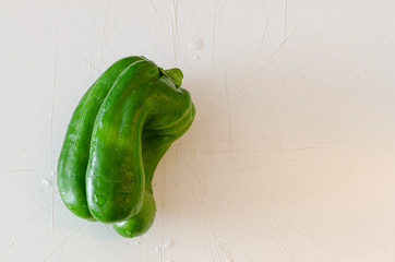 green bell pepper on cutting board