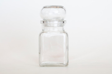 Transparent glass kitchen bottle with lid used for herbs or liquids