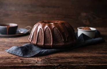 Fotobehang Delicious dessert, dark chocolate bundt cake topped with ganache glaze © Marcus Z-pics
