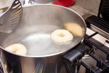 Process of making homemade bagels, boing them in the pan