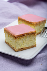 Tompoes or tompouce, iconic pastry in Netherlands and Belgium made from puff dough, icing, cream