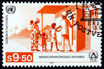 Postage stamp United Nations 1987 Family Entering Home