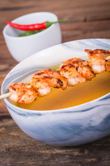 Grilled Shrimp skewer and squash soup bowl