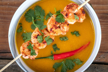 Grilled Shrimp skewer and squash soup bowl