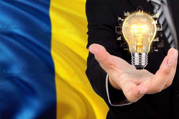 Chad creativity concept. Businessman with a light bulb in his hand on national background....