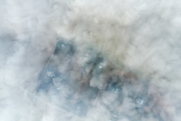 In the skies above the fog. Sunrise over the fog. Clouds near th