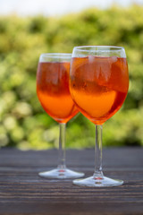 Aperol spritz drink in a wineglass. Ice and slice of orange