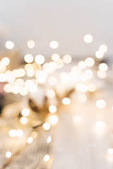 Yellow bokeh background of Christmas lights, blurred electric garland