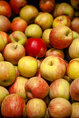 Apples at market store. Food background. Vertical photo 