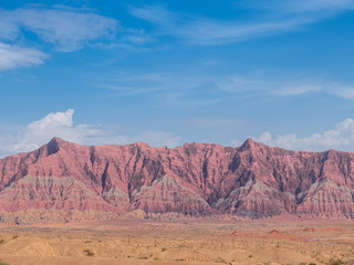 Fototapeta na wymiar The red rock formations of Danxia landform in Xinjiang of China