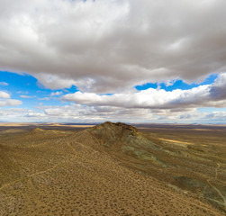 dramatic clouds over mountain in mojave desert
