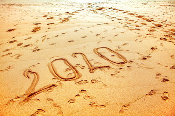 New Year 2020 inscription on the beach 