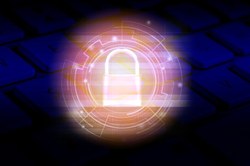 Data security systems computer with locked padlock on dark keyboard for protect crime by an anonymous hacker / technology background cyber security