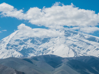 Great snow-capped mountain peak of Mount Muztag Ata on the Pamirs Plateau