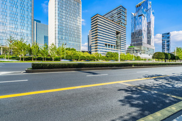 cityscape and skyline of shanghai from empty asphalt road.