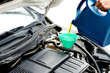 Refueling and pouring oil quality into the engine motor car Transmission and Maintenance Gear...