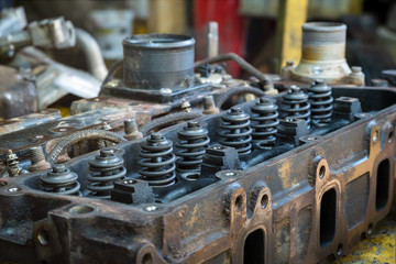 Obraz na płótnie Canvas spring valve in cylinderhead of diesel engine on working table