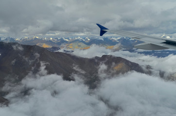 Naklejka na ściany i meble Arial view Snow peaks of himalayas from Flight window, Ladakh, India, Asia