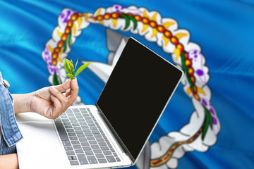 Northern Mariana Islands modern agriculture concept. Farmers holding laptop, check tea on national flag background. Ecology theme with copy space.