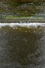 Heavy rain caused flooding over grass strip, curb, and road