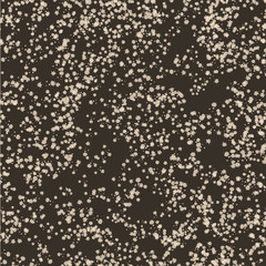Beige dots blots on a brown background. Seamless texture for fab