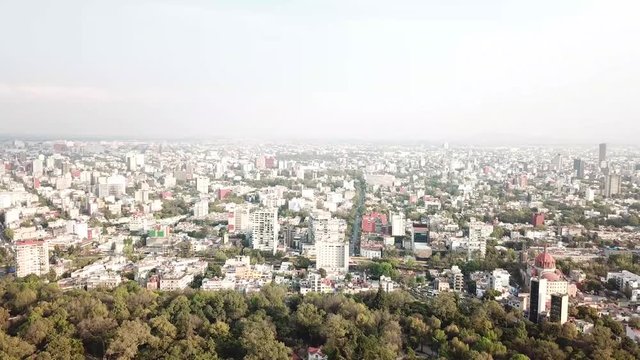Take aerial view of the city of Mexico seen from the Chapultepec forest where you can see the beauty of the city although with a lot of pollution.