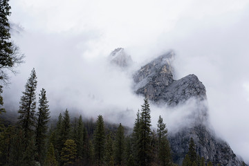 Mountain surrounded by intense fog and clouds