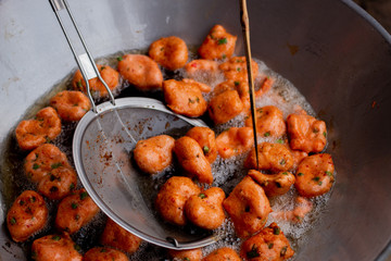 Making delicious fried fish cake in hot oil. The name of this menu is Tod Mun Pla Krai.