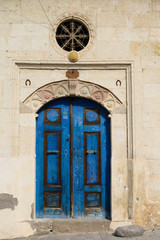 Deep blue door of stone house in Mustafapasa village Cappadocia Turkey