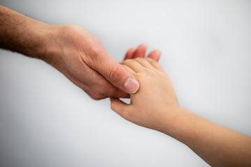 father and daughter hold hands