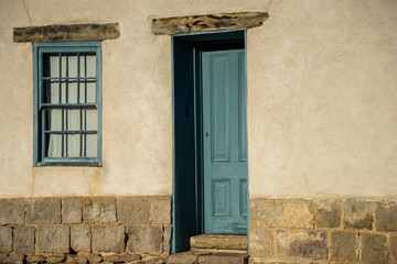 Fototapeta na wymiar Blue door of an old Tucson adobe house