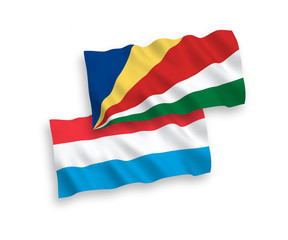 Flags of Seychelles and Luxembourg on a white background