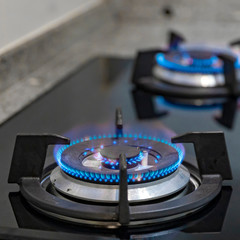 Burning natural gas on gas burner on dark background