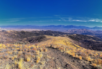 Views of Wasatch Front Rocky Mountains from the Oquirrh Mountains with fall leaves, Hiking in Yellow Fork trail and Rose Canyon in Great Salt Lake Valley. Utah, United States. USA.