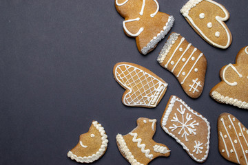 Gingerbread man. Xmas homemade Ginger, Honey cookies on dark background. Merry Christmas greeting card, banner. Winter holiday xmas theme. Happy New Year. Space for text