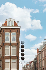 Fototapeta na wymiar Closeup shot of buildings in amsterdam with a empty signboard