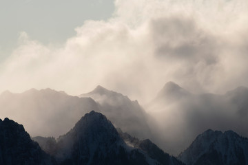 clouds over and through mountains